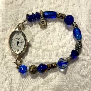 Geneva Quartz stainless steel back beaded bracelet watch